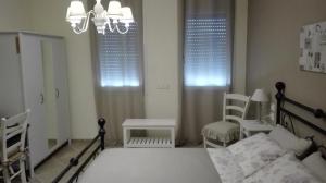 Postel nebo postele na pokoji v ubytování B&B Borgo Arcadia
