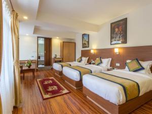 Letto o letti in una camera di Oasis Kathmandu Hotel