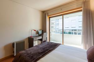 Un pat sau paturi într-o cameră la Onice Apartment