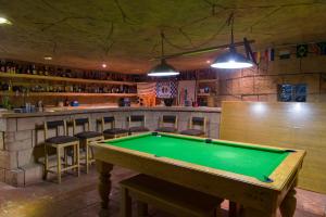a pool table in a room with a bar at Bayswater Lodge in Bloemfontein