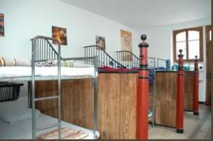 a group of bunk beds in a room at Funny Farm Backpackers in Interlaken