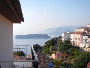 a view of the ocean from a balcony of a house at Albergo Il Brillantino in San Nicola Arcella