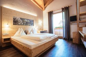 Postel nebo postele na pokoji v ubytování Hotel Wildschütz