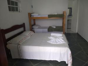 Postel nebo postele na pokoji v ubytování Pousada Popeye