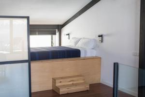 Postel nebo postele na pokoji v ubytování Bubusuites