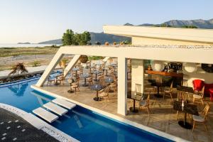 a view of a resort with a swimming pool at Alexandra Golden Boutique Hotel-Adults Only in Chrysi Ammoudia