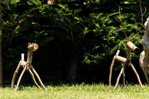 a group of three people standing in the grass at Alexandra Golden Boutique Hotel-Adults Only in Chrysi Ammoudia