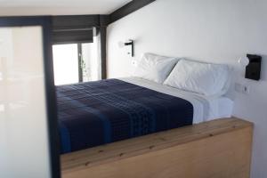 Postel nebo postele na pokoji v ubytování Bubusuites