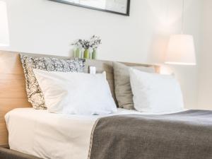 
Ein Bett oder Betten in einem Zimmer der Unterkunft Restaurant-Hotel Maien
