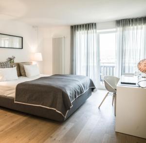 Säng eller sängar i ett rum på Restaurant-Hotel Maien
