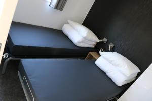 Postel nebo postele na pokoji v ubytování Stadscamping Zeeland