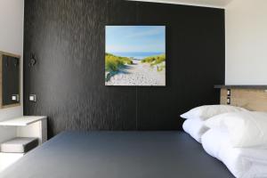 Een bed of bedden in een kamer bij Stadscamping Zeeland