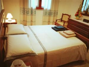 Кровать или кровати в номере B&B Su Briglioni