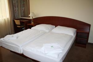Ein Bett oder Betten in einem Zimmer der Unterkunft Hotel Petr