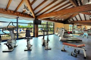 a gym with several treadmills and cardio machines at Hotel Oran Bay Managed By Accor in Oran