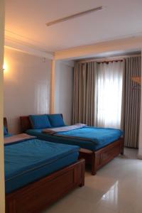 Postel nebo postele na pokoji v ubytování DaLat Sky Hostel