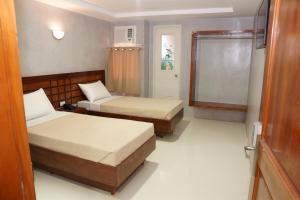 Voodi või voodid majutusasutuse Hotel Rodolfo toas