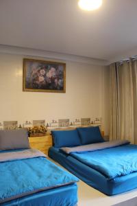 Postel nebo postele na pokoji v ubytování DaLat Sky Hostel