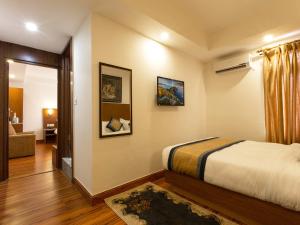 Letto o letti in una camera di Oasis Kathmandu Hotel