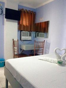 Voodi või voodid majutusasutuse UKL Ever Resort Hotel toas