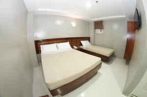 Voodi või voodid majutusasutuse Hotel Rodolfo toas