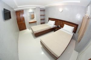 Voodi või voodid majutusasutuse Hotel Rodolfo toas