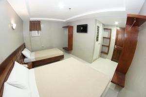 Voodi või voodid majutusasutuse Hotel Rodolfo toas