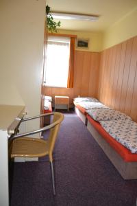Posteľ alebo postele v izbe v ubytovaní Hostel Fortuna