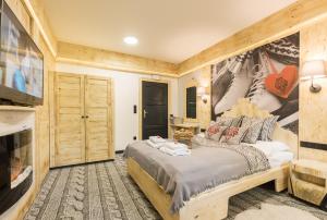 Łóżko lub łóżka w pokoju w obiekcie Apartament Owcze Runo Zakopane