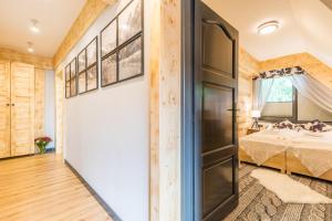 Łóżko lub łóżka w pokoju w obiekcie Apartament Owcze Runo Zakopane