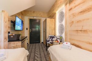 Telewizja i/lub zestaw kina domowego w obiekcie Apartament Owcze Runo Zakopane