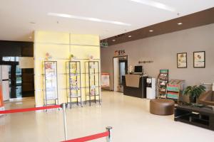 a lobby of a store with signs on the wall at Jinjiang Inn Tianshui Chunfeng Road in Tianshui