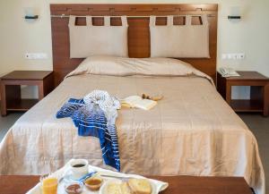 Posteľ alebo postele v izbe v ubytovaní Kymi Palace