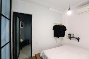 Voodi või voodid majutusasutuse Sleeping Well Chiangkhong toas