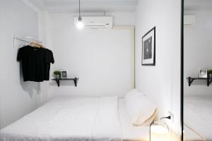 Voodi või voodid majutusasutuse Sleeping Well Chiangkhong toas