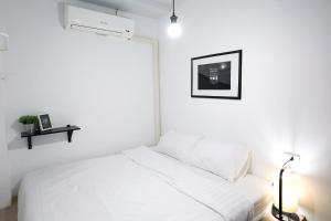 Voodi või voodid majutusasutuse Sleeping Well Chiangkhong toas