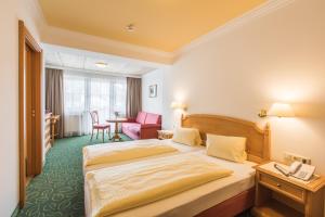 Postel nebo postele na pokoji v ubytování Hotel Niederreiter