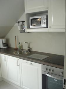 Kuchyň nebo kuchyňský kout v ubytování Ferienwohnung Möwennest