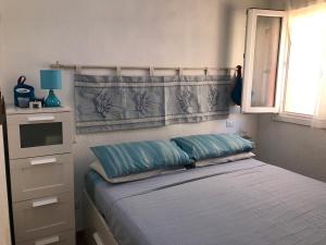 Een bed of bedden in een kamer bij H24 Vacanze