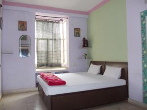 Voodi või voodid majutusasutuse Raj Mahal Guest House toas