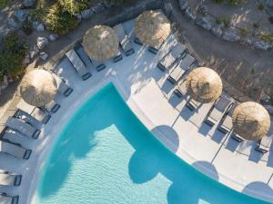 an overhead view of a pool with chairs and umbrellas at Hotel Club Le Capet in Sainte-Maxime