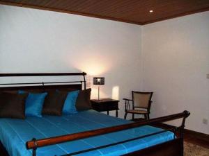 Postel nebo postele na pokoji v ubytování Quinta do Jaco