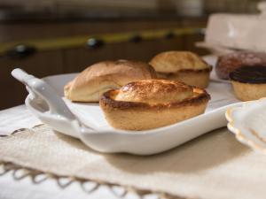 a plate with three muffins on a table at B&B Villa Ines in Leuca
