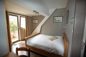Postel nebo postele na pokoji v ubytování Hotel Piano 2 - Mont-St-Guibert - Louvain-la-Neuve