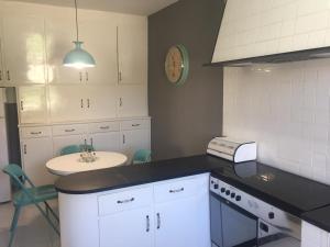 a kitchen with a sink and a counter top at Getxo, parking, wifi, metro in Getxo
