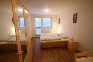 Ένα ή περισσότερα κρεβάτια σε δωμάτιο στο Apartmenty PATRIS