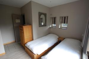 Postel nebo postele na pokoji v ubytování Hotel Piano 2 - Mont-St-Guibert - Louvain-la-Neuve