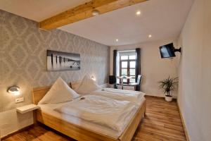 Postel nebo postele na pokoji v ubytování Hotel Packhaus
