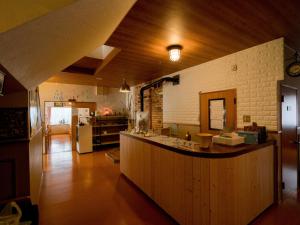 Guesthouse Hoshizora no Akari tesisinde mutfak veya mini mutfak