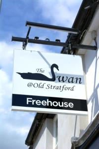a sign for the swan oldham seafood firehouse at The Swan @Old Stratford in Milton Keynes